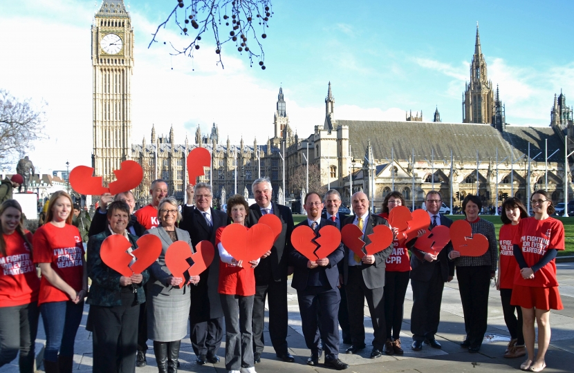 Sir Oliver pictured outside Parliament with other MPs and BHF staff
